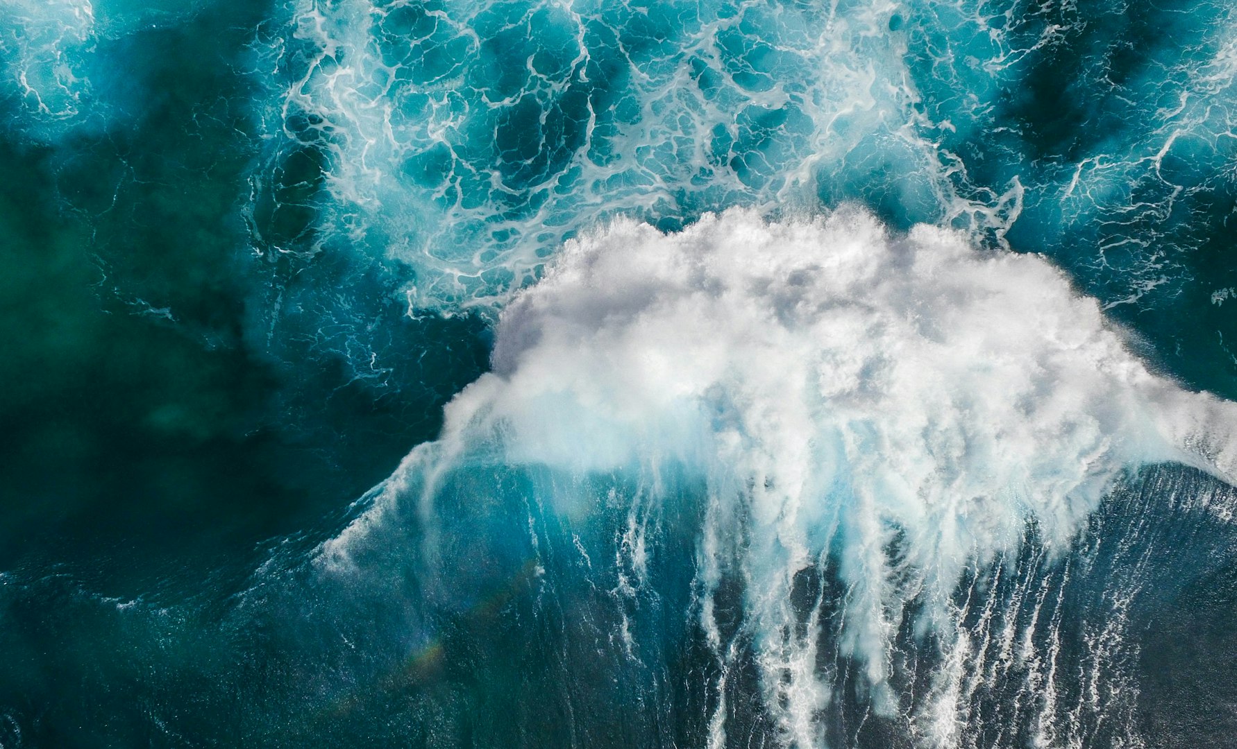 Waves crashing into ocean